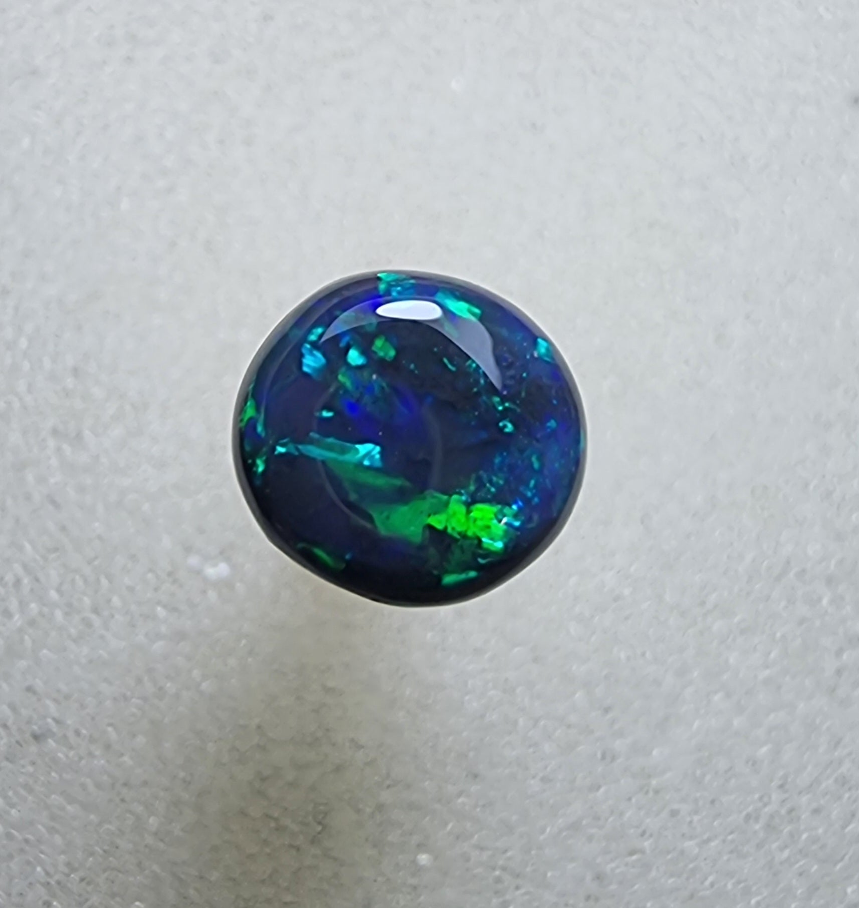 A431 - Stunning circle cut black opal