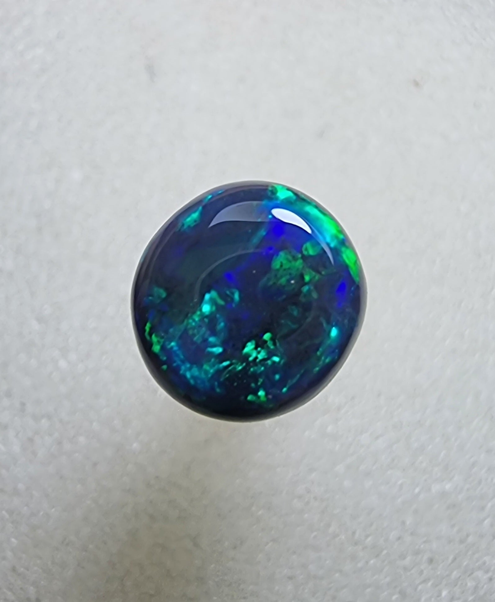 A431 - Stunning circle cut black opal