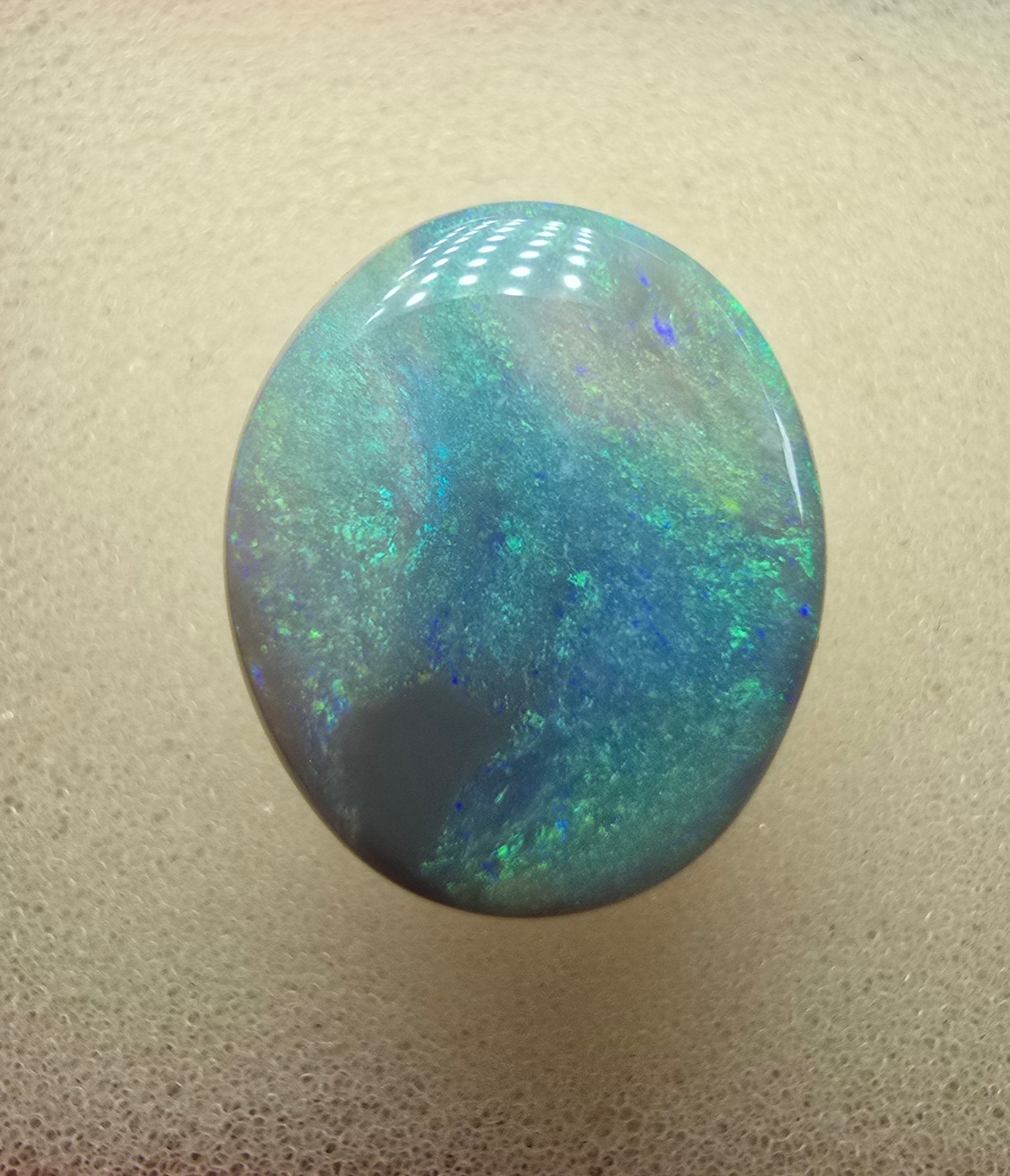 A606 - Large broad faced dark opal
