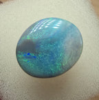 A606 - Large broad faced dark opal