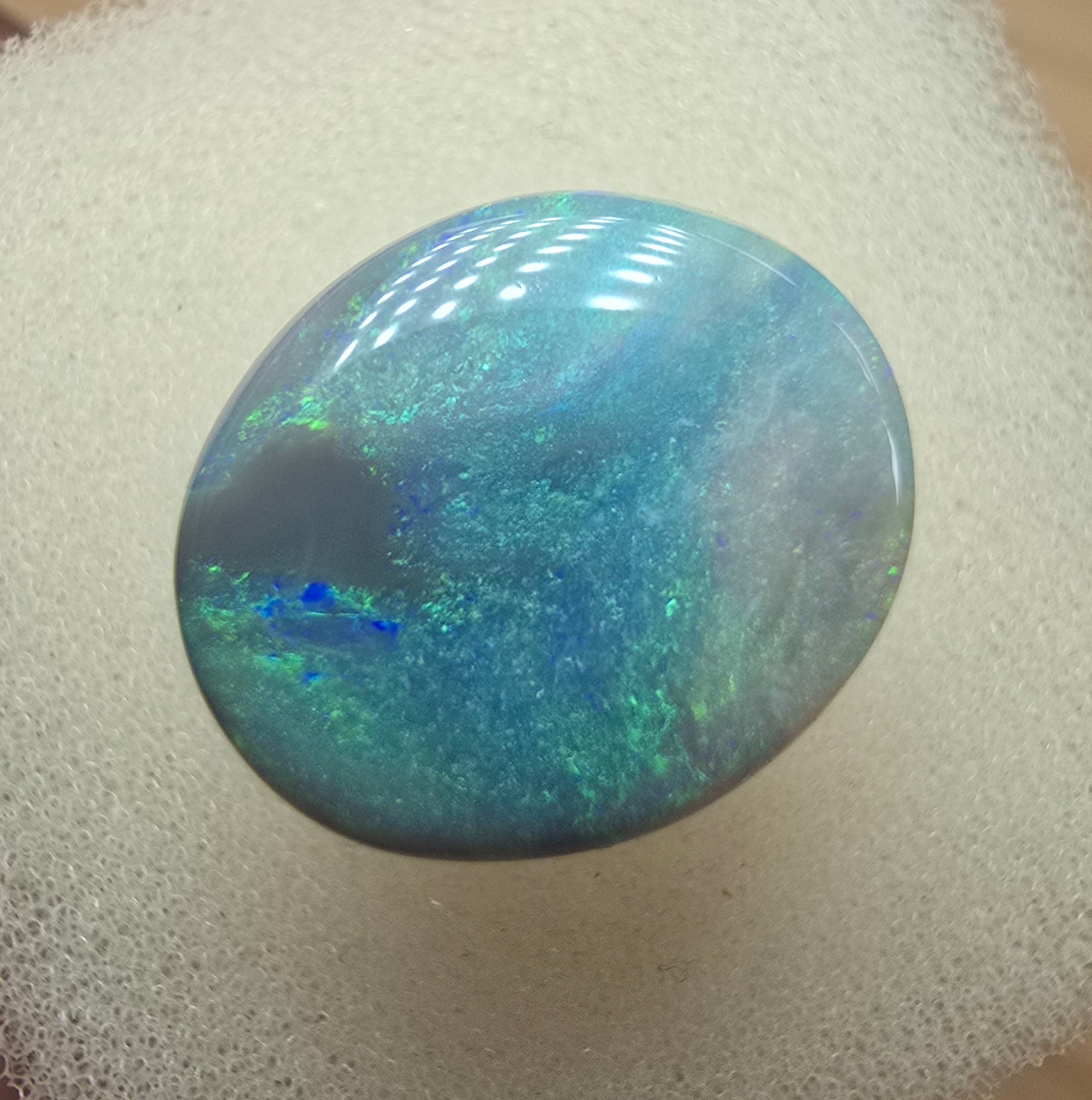 A606 - Large broad faced dark opal