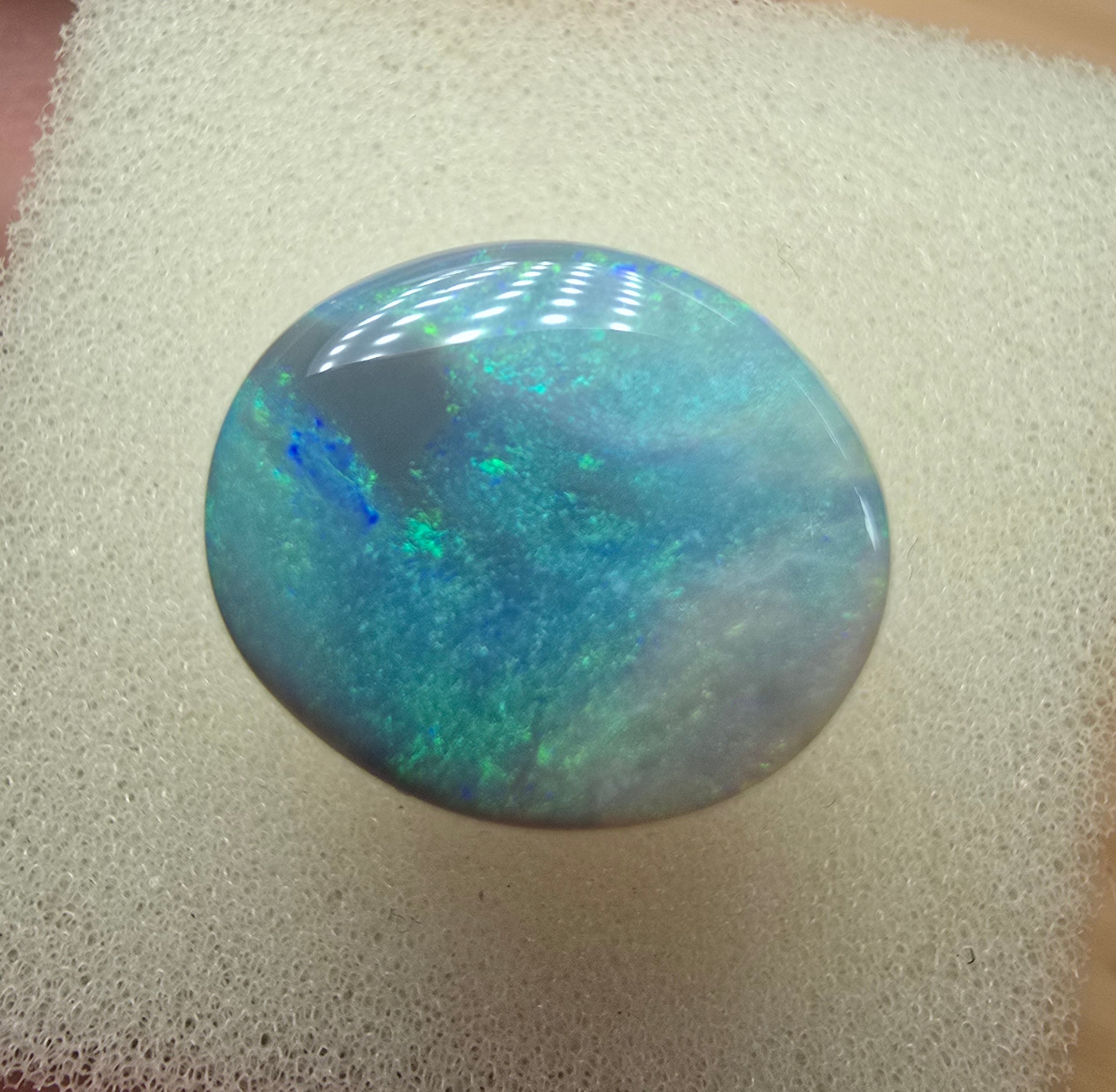 A606 - Large broad faced dark opal