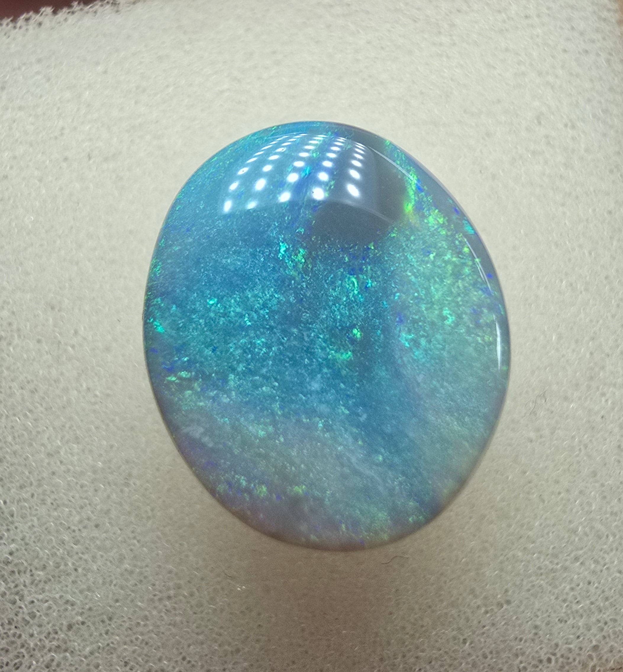 A606 - Large broad faced dark opal