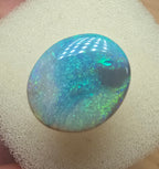 A606 - Large broad faced dark opal