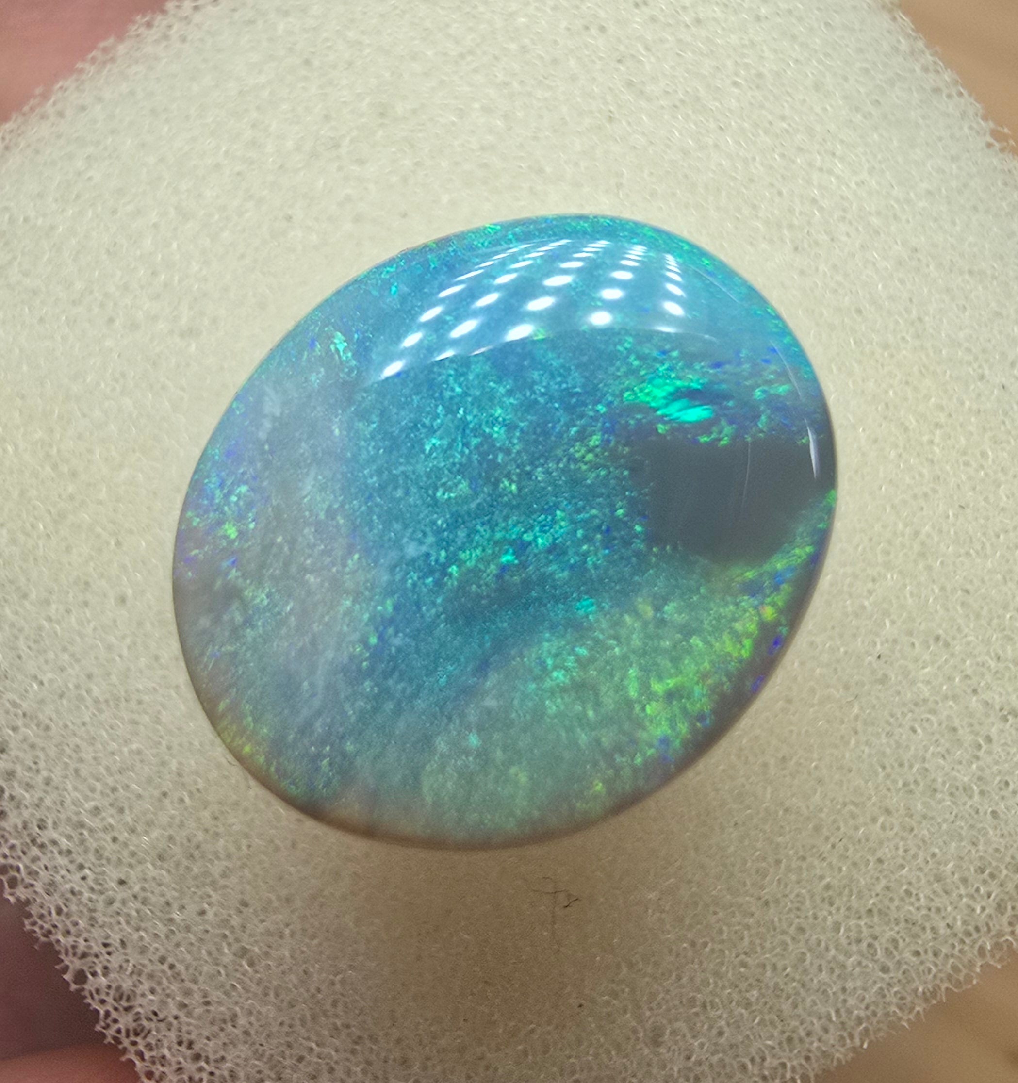 A606 - Large broad faced dark opal