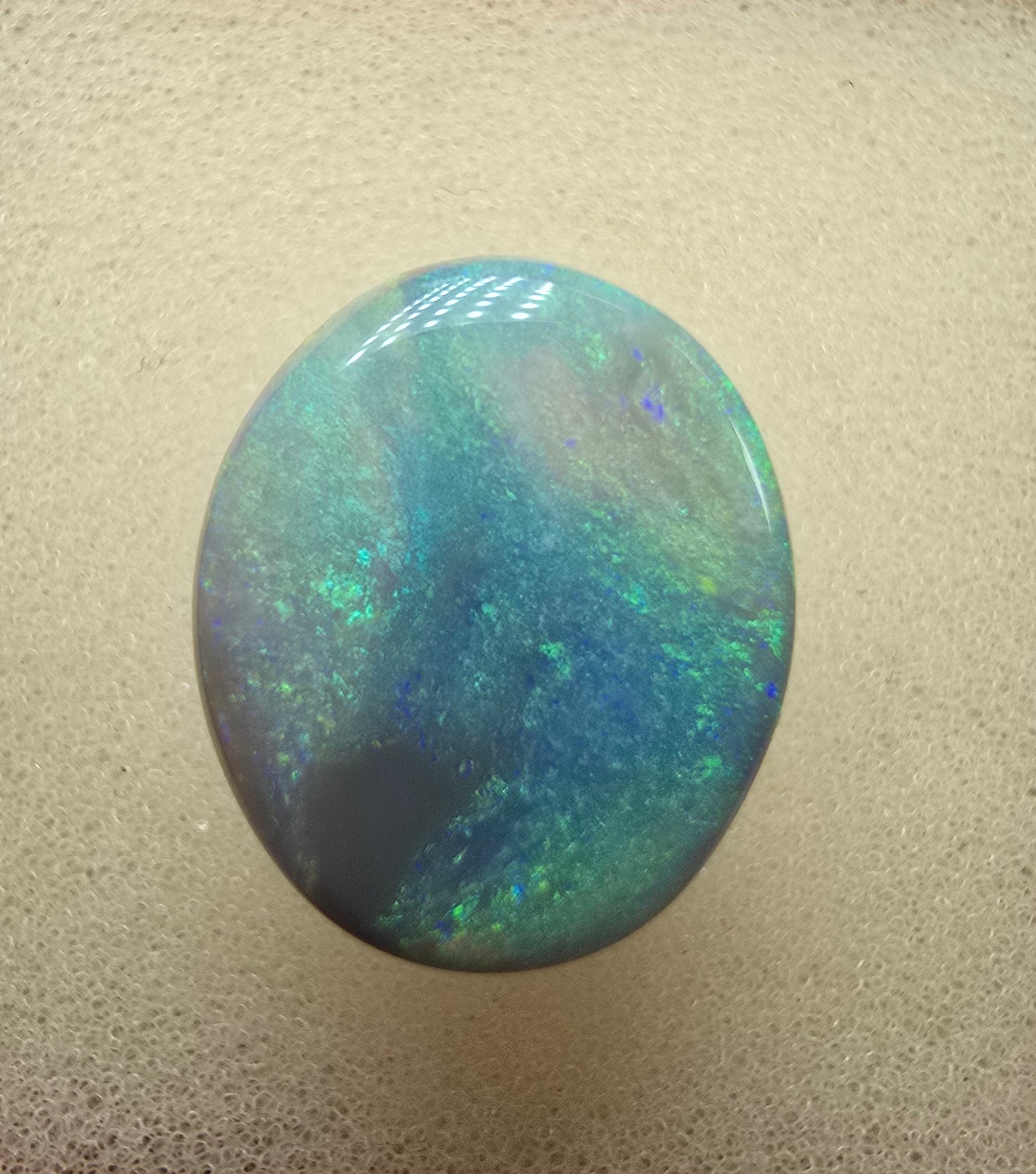 A606 - Large broad faced dark opal