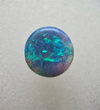 A666 - Bright round cut black opal