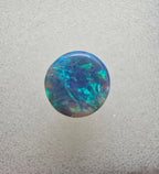 A666 - Bright round cut black opal