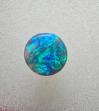 A666 - Bright round cut black opal