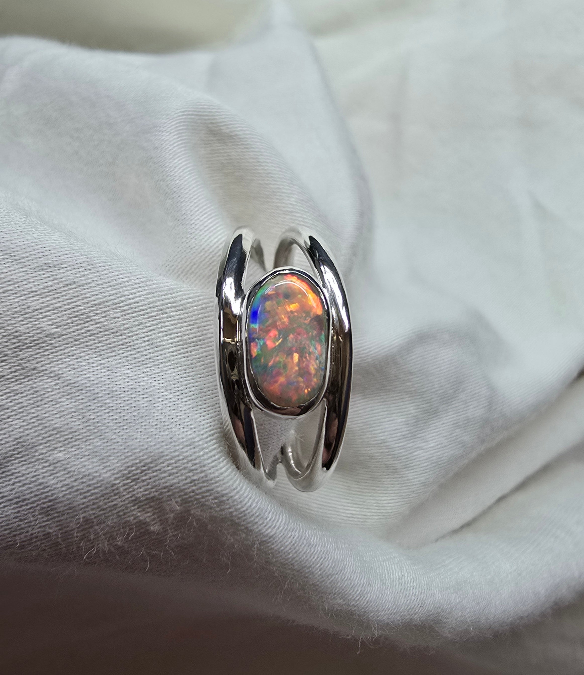 J011 - Bright multicoloured dark opal ring