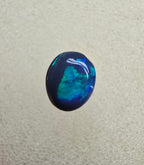 A826 - Small cab blue on black opal