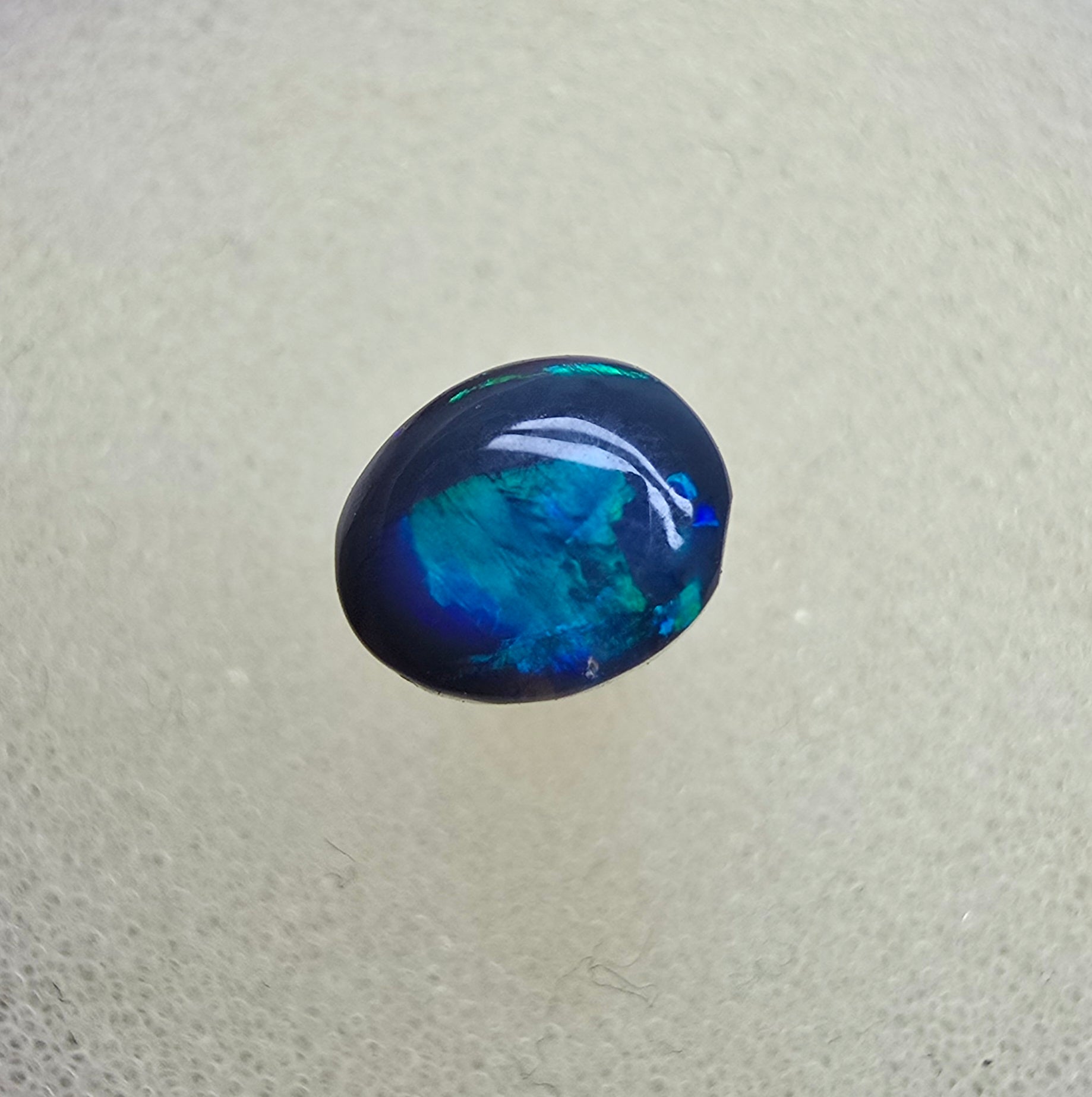 A826 - Small cab blue on black opal