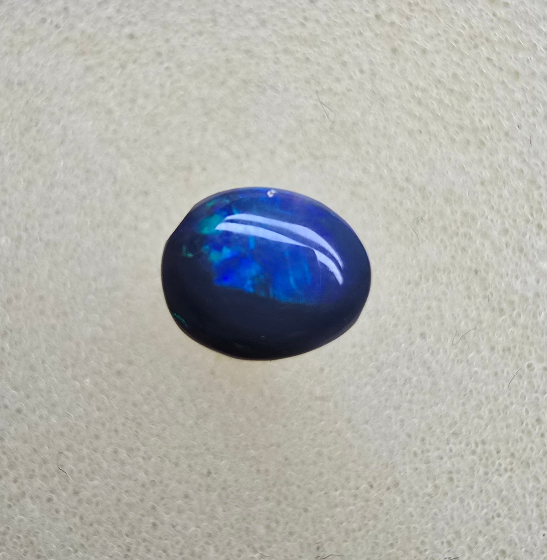 A826 - Small cab blue on black opal