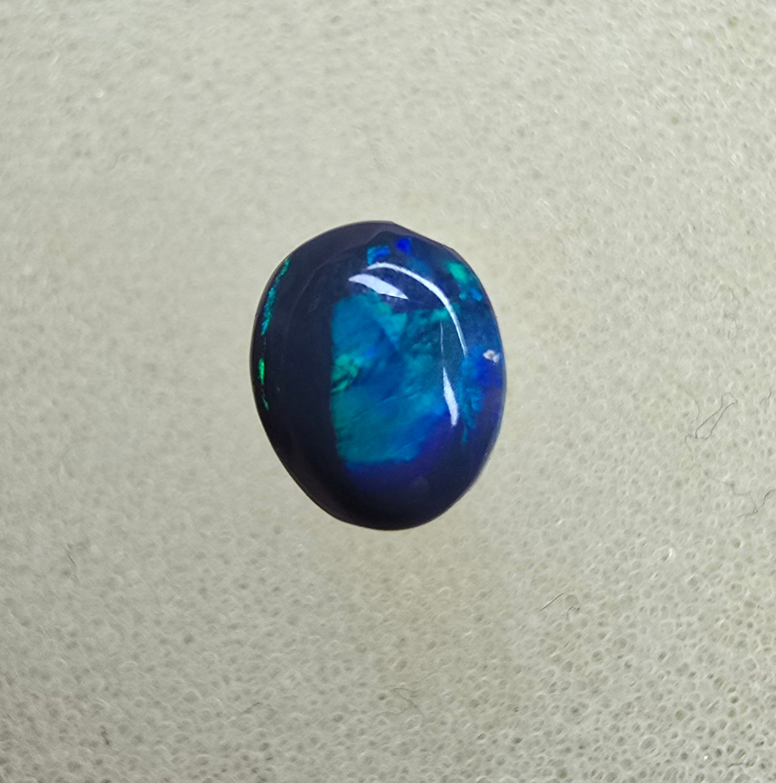 A826 - Small cab blue on black opal