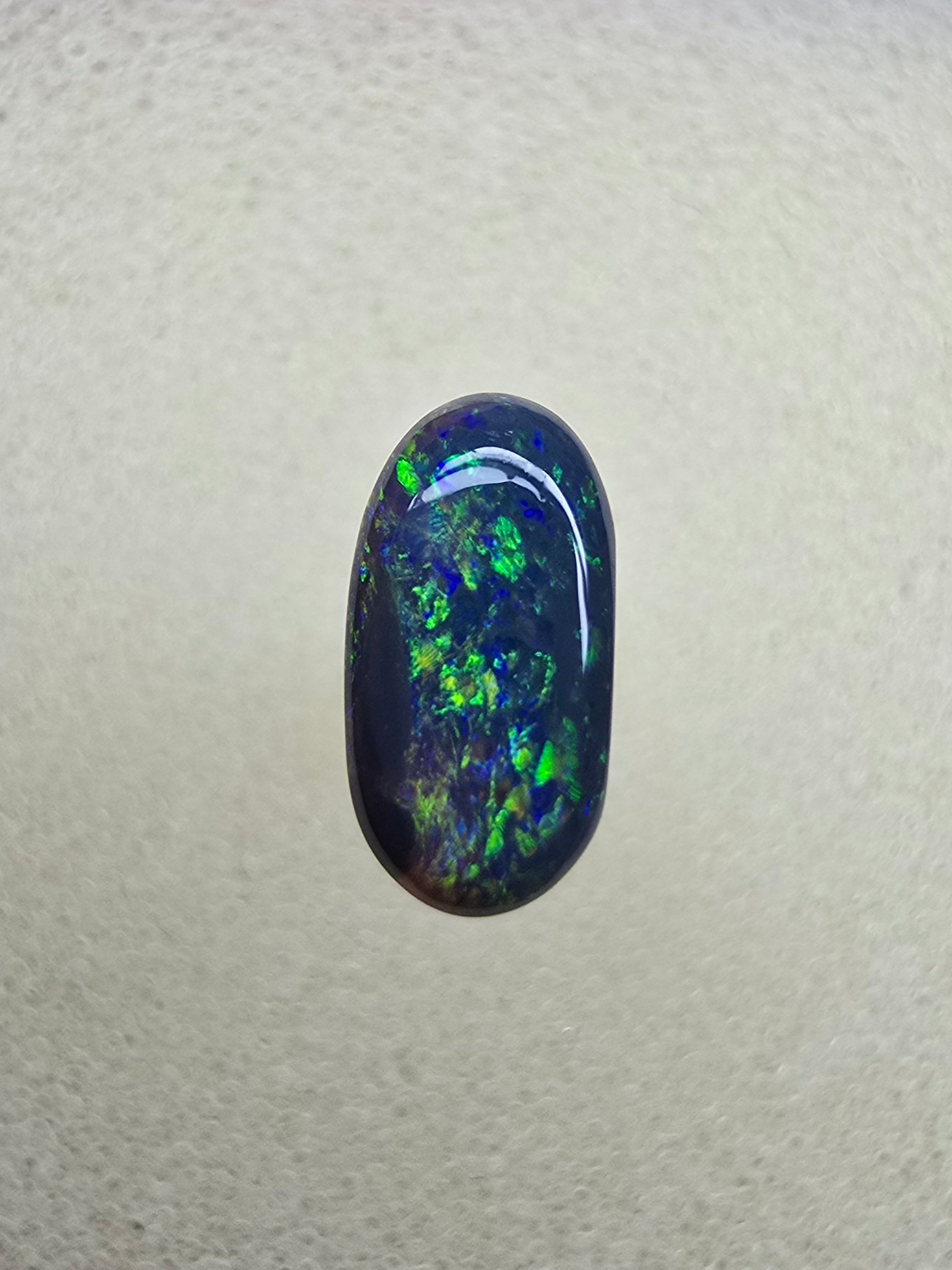 A839 - Oval cut black opal beauty