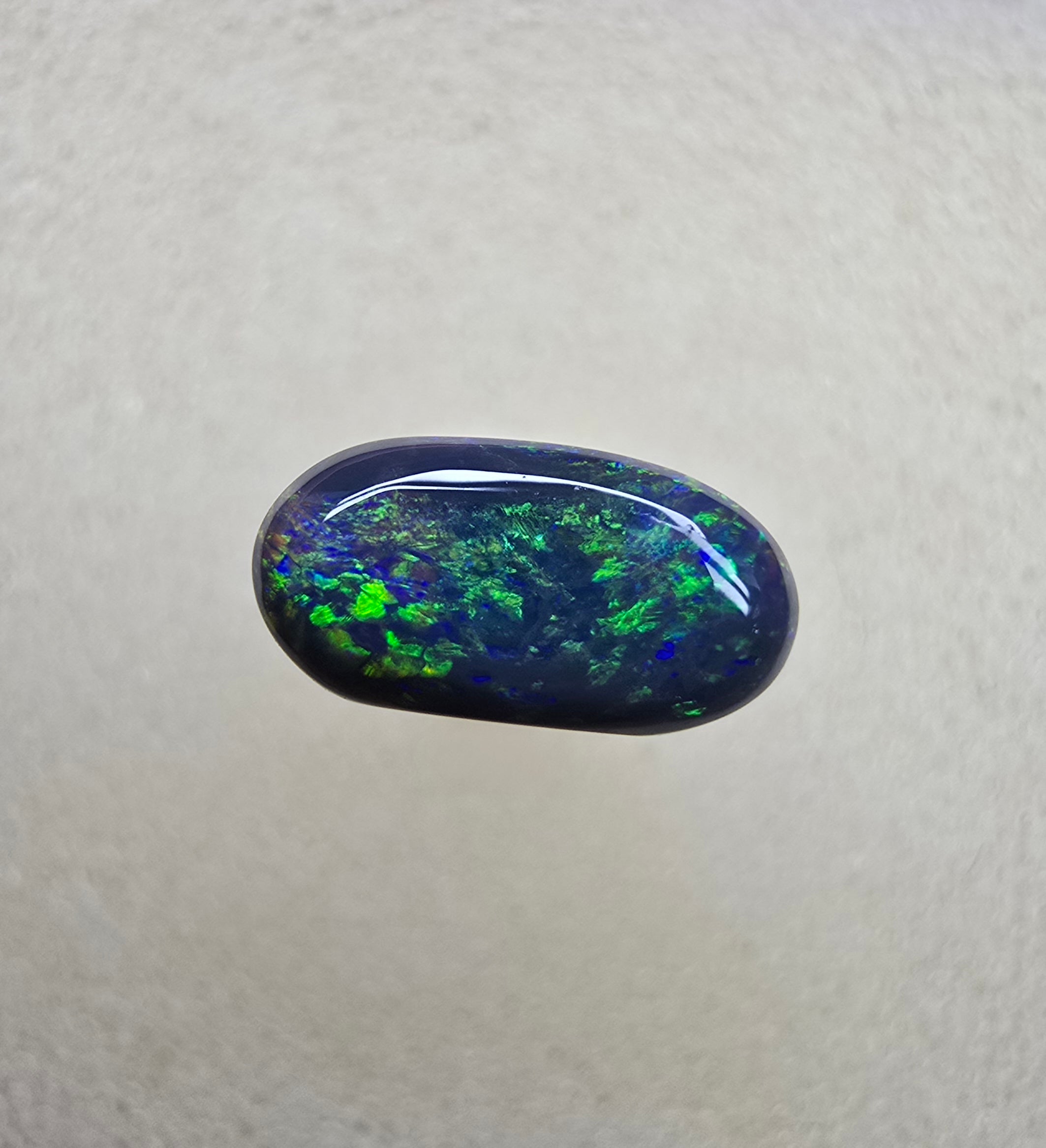 A839 - Oval cut black opal beauty