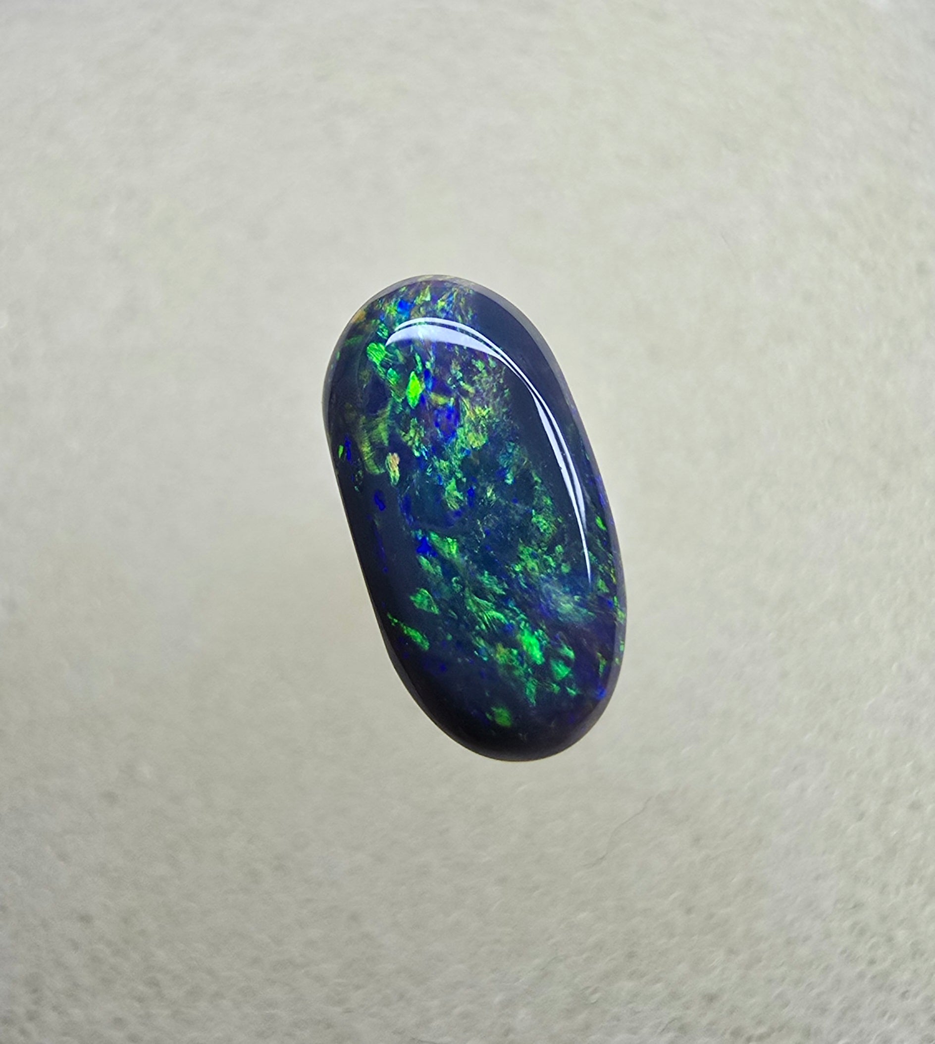 A839 - Oval cut black opal beauty