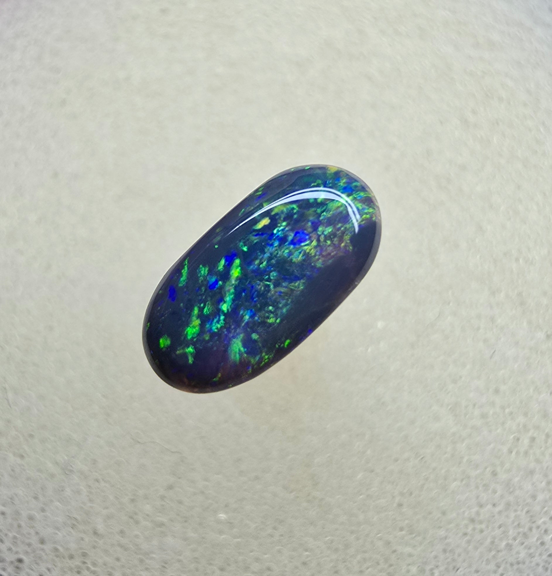 A839 - Oval cut black opal beauty
