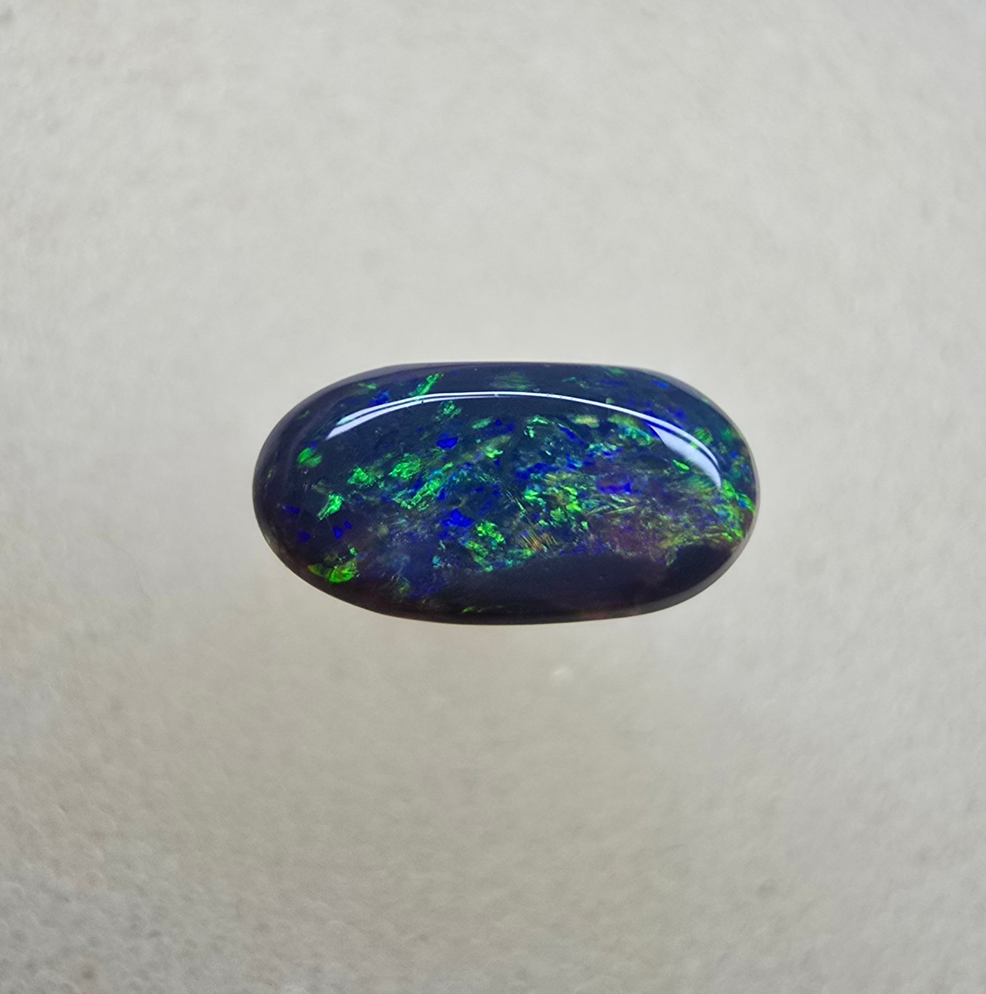 A839 - Oval cut black opal beauty