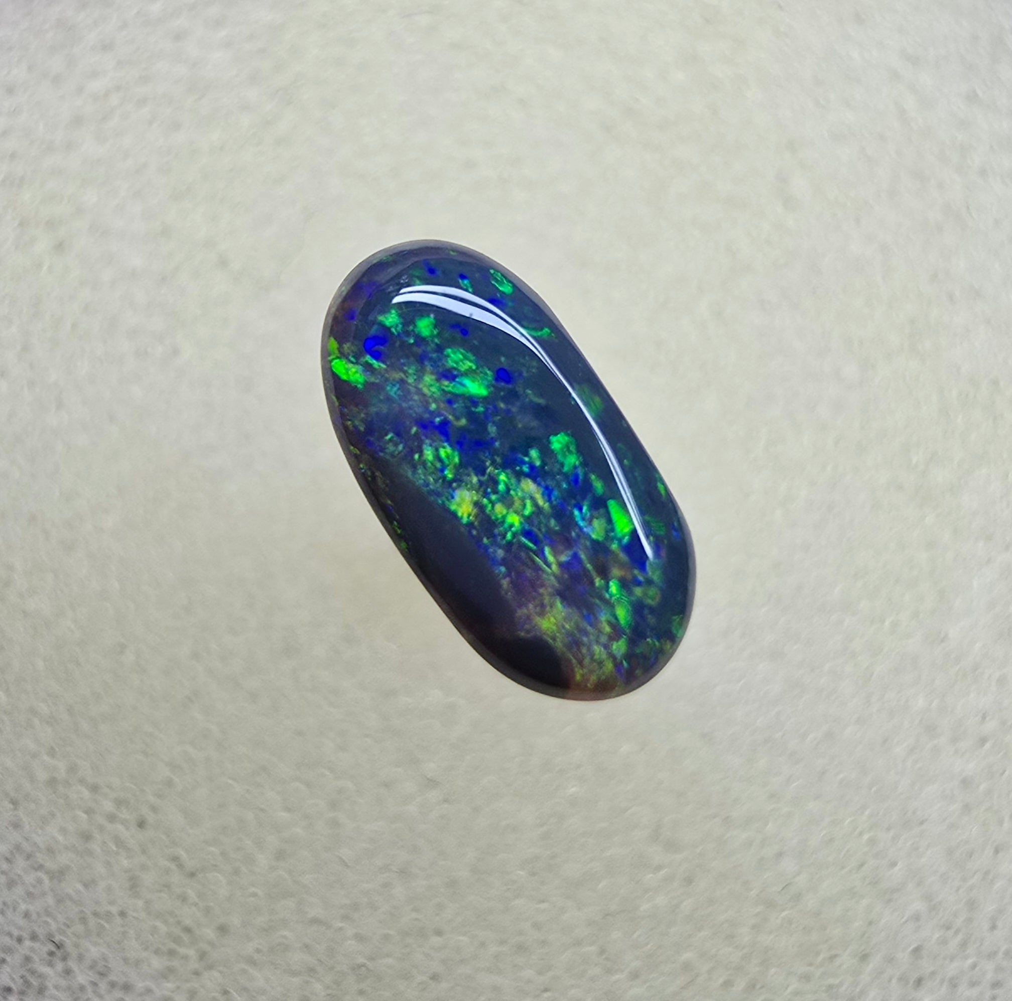 A839 - Oval cut black opal beauty