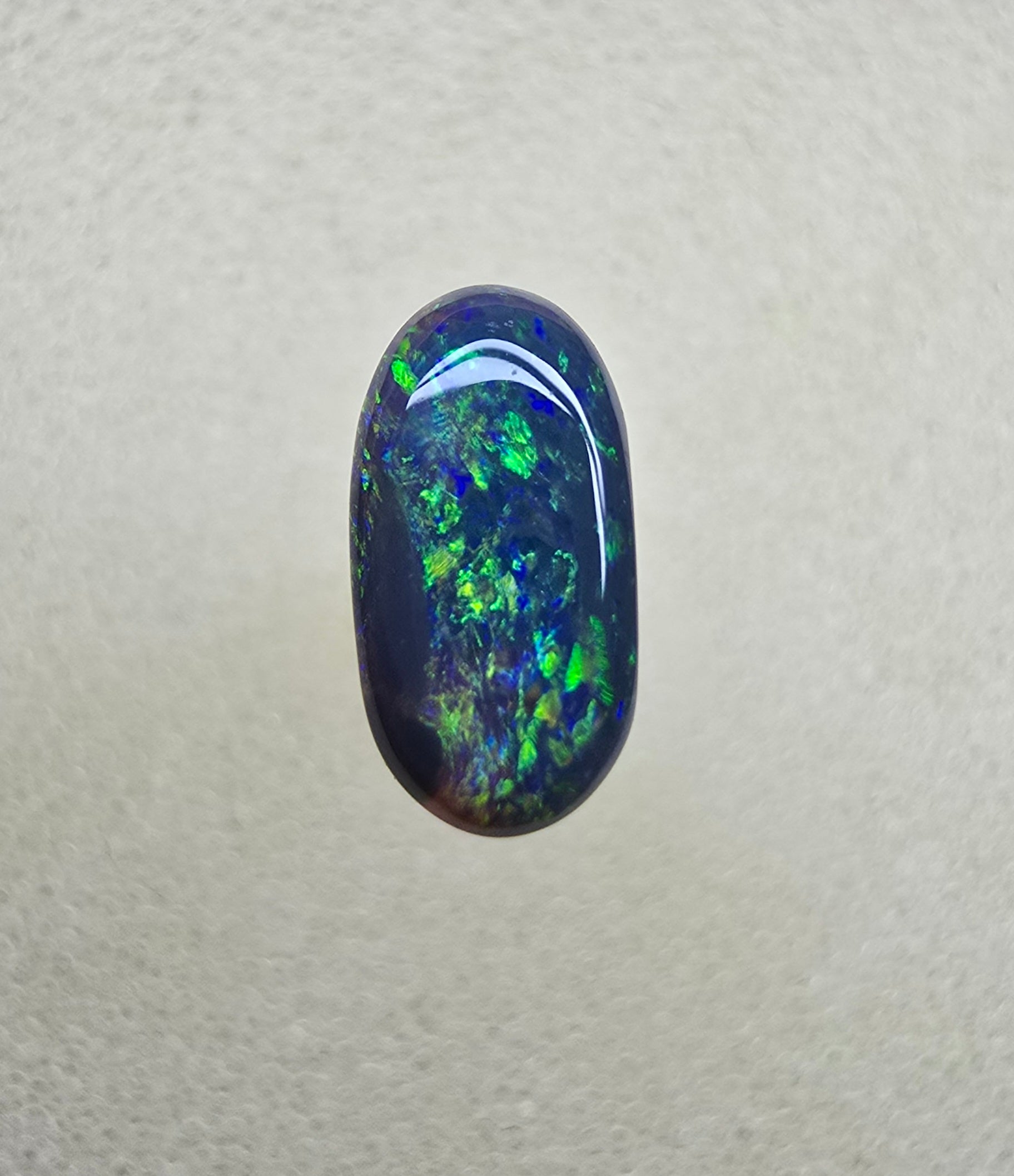 A839 - Oval cut black opal beauty