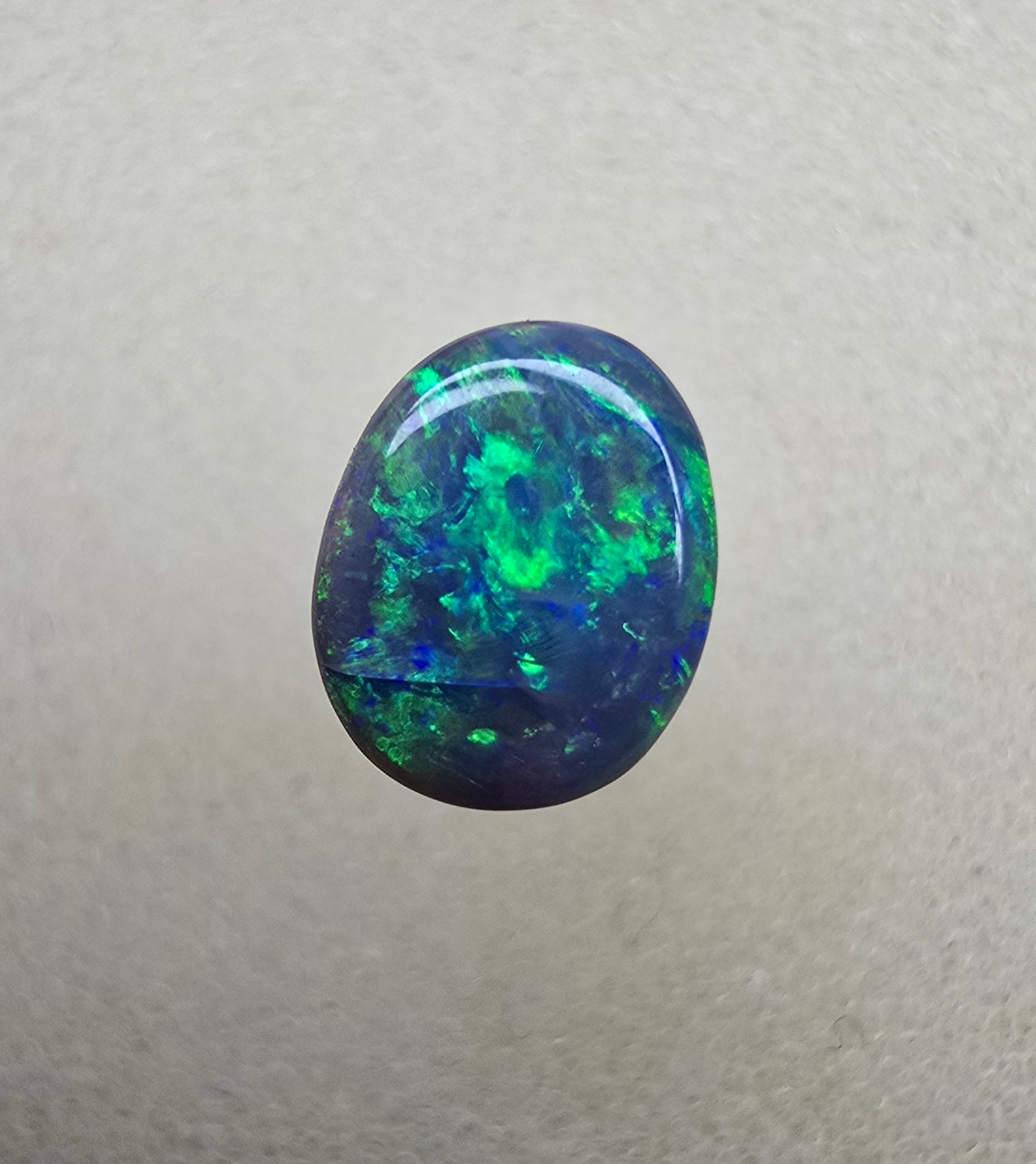 A841 - Bright oval cut black opal