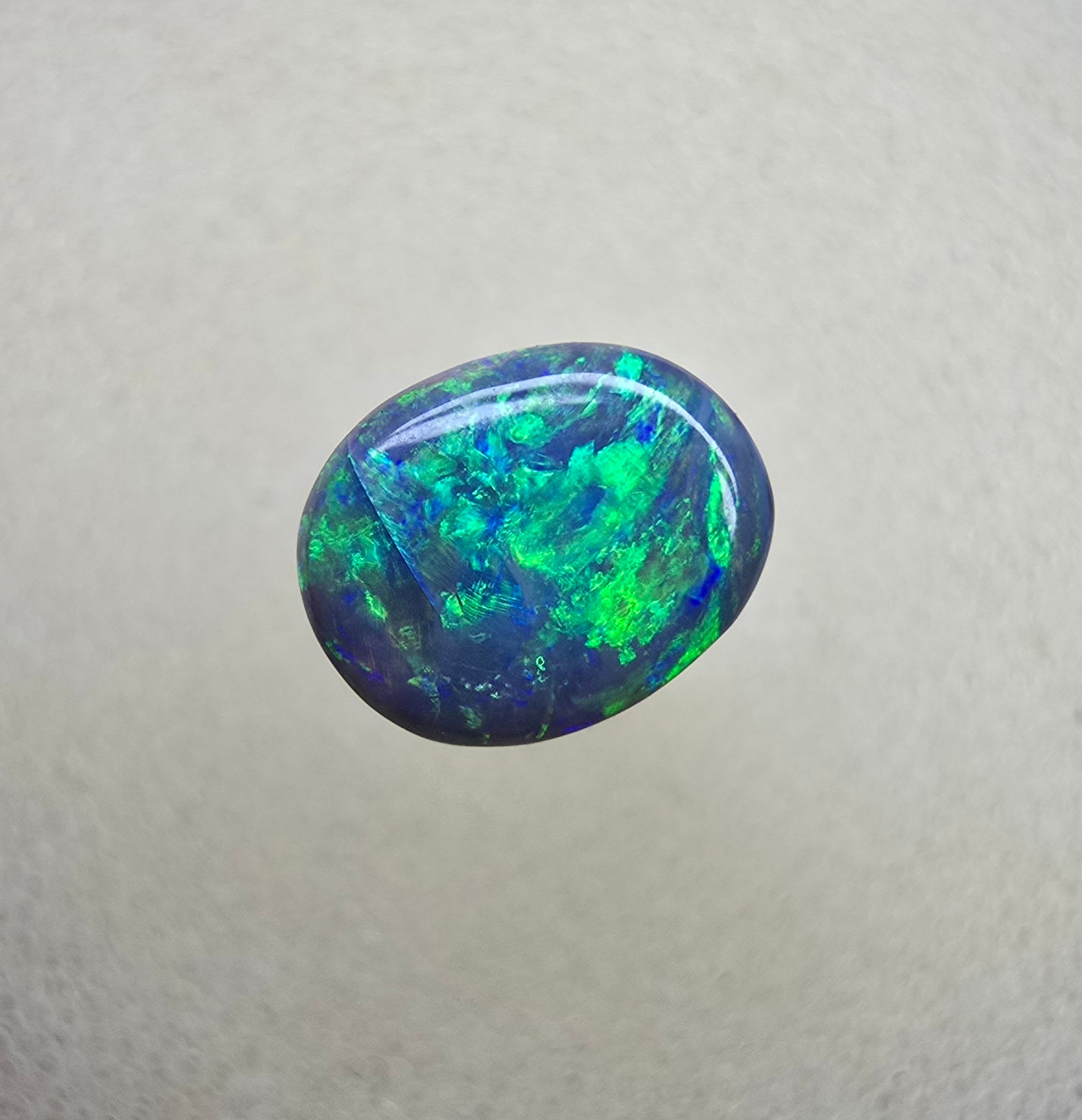 A841 - Bright oval cut black opal