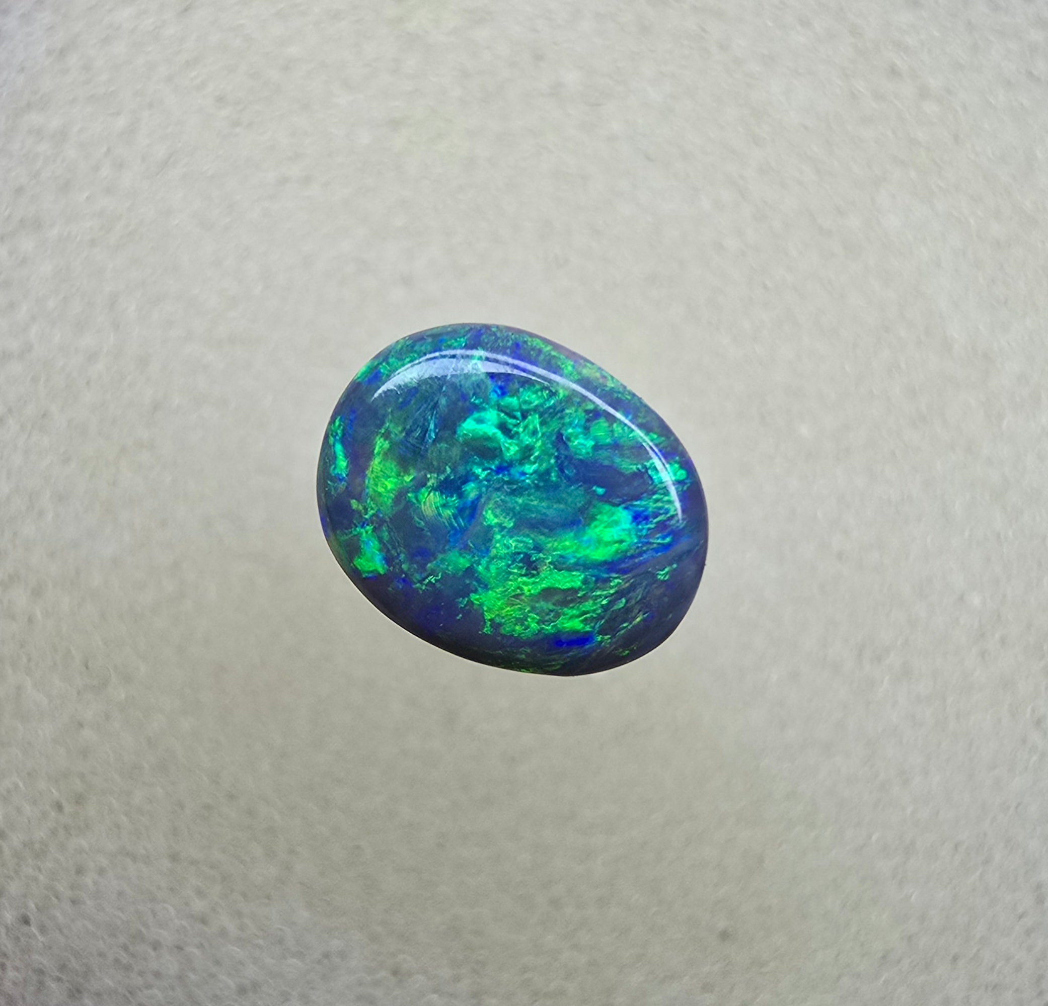 A841 - Bright oval cut black opal
