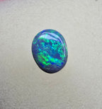A841 - Bright oval cut black opal
