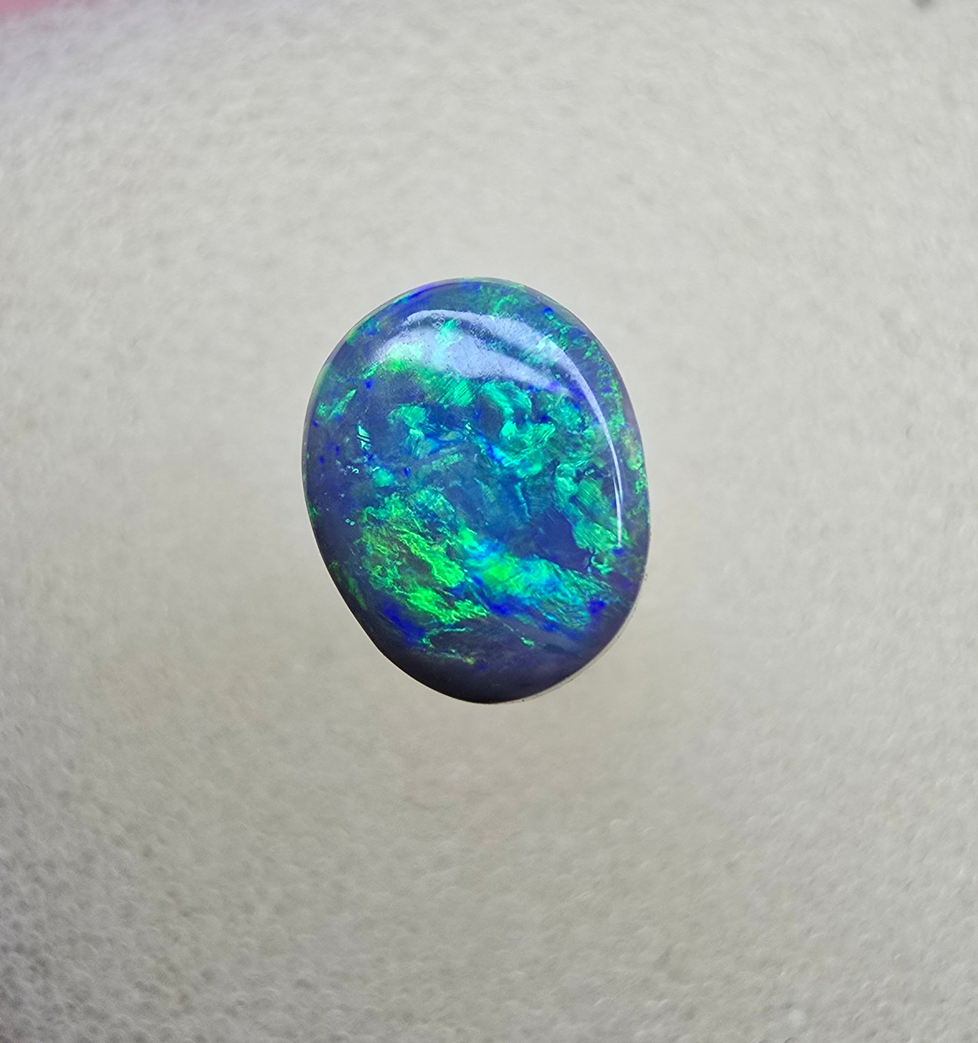 A841 - Bright oval cut black opal