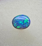 A841 - Bright oval cut black opal