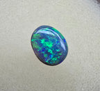 A841 - Bright oval cut black opal