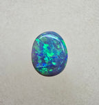 A841 - Bright oval cut black opal