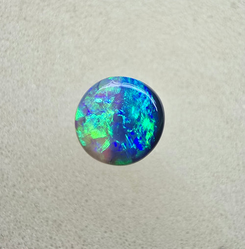 A845 - Round cut gem black opal