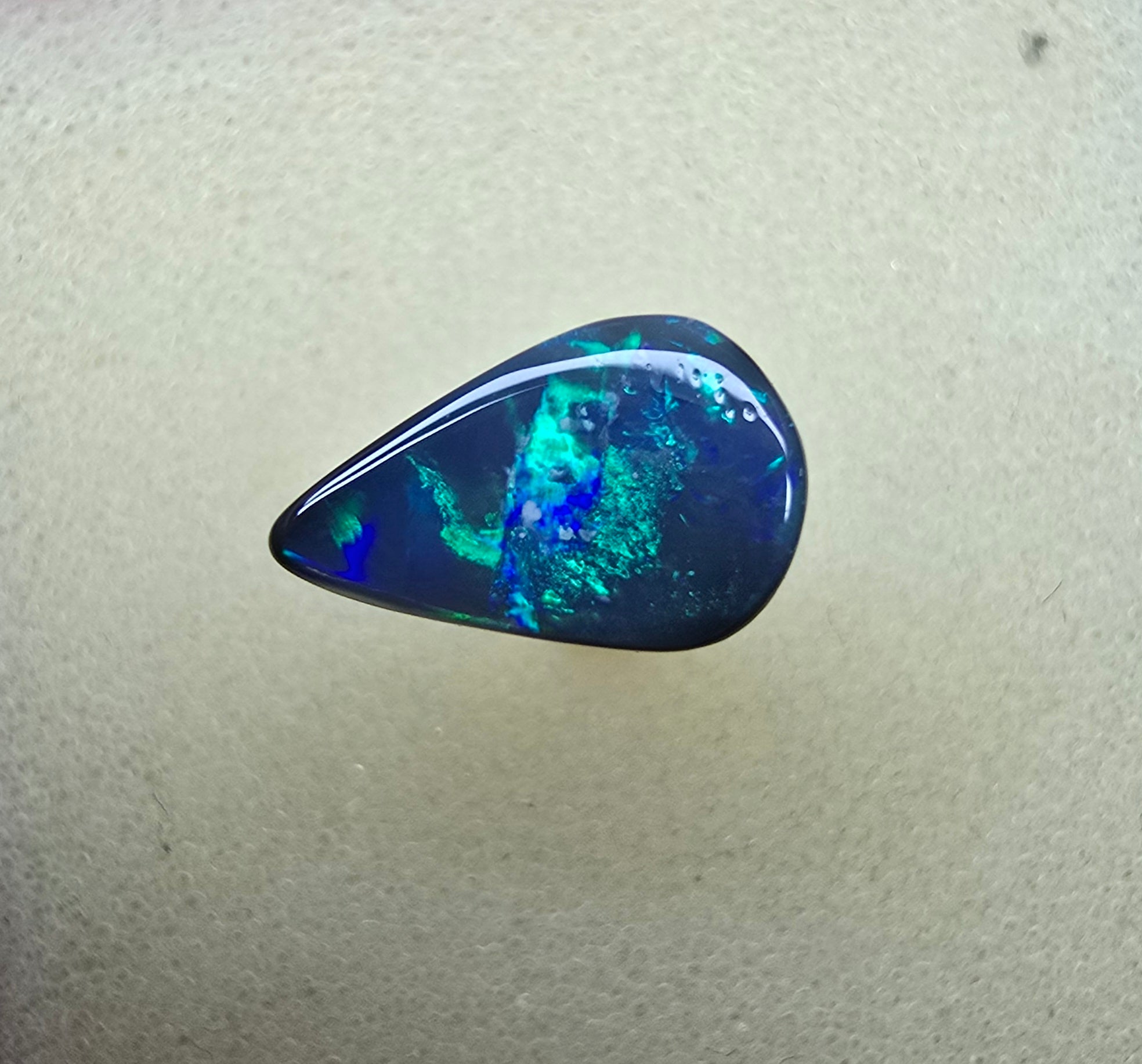 A858 - Drop cut black opal