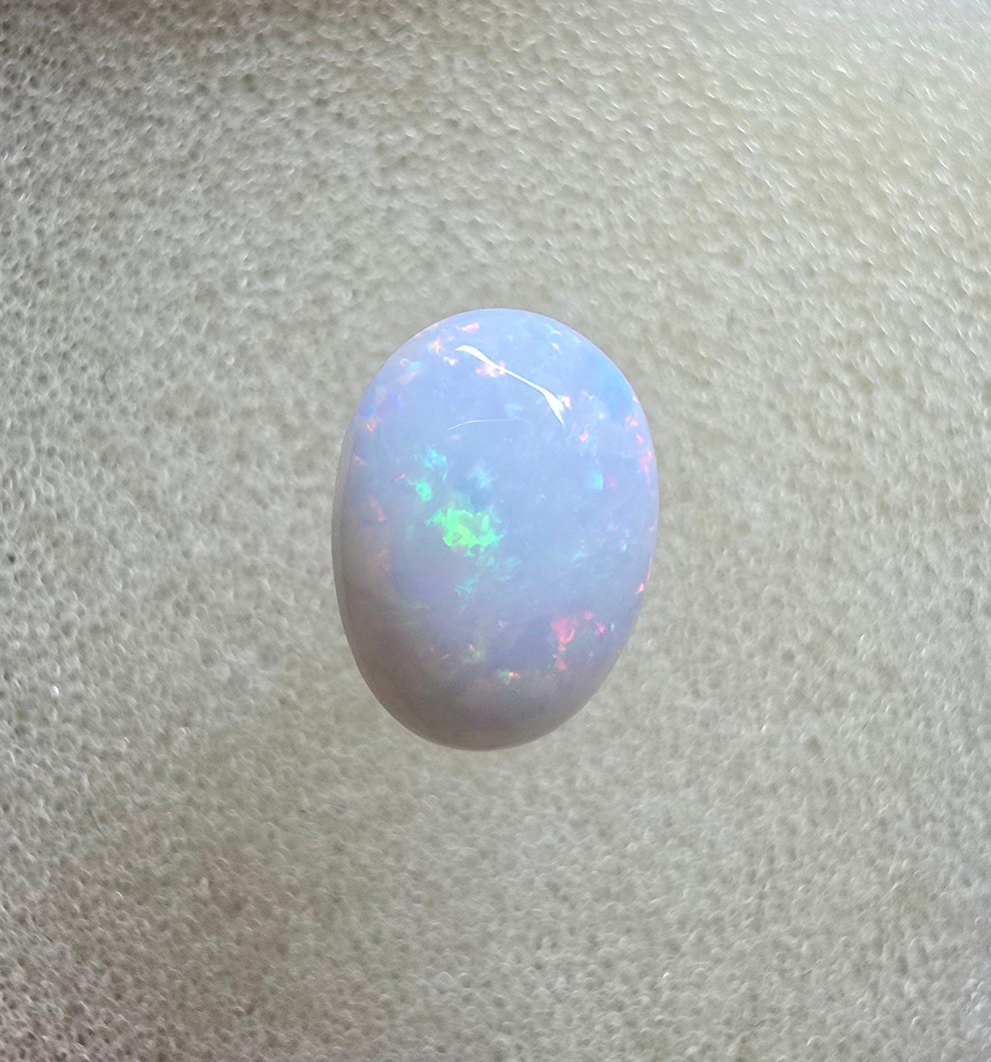 A889 - Pearl white round cut opal