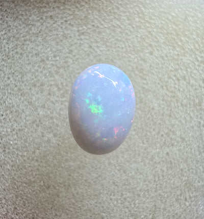 A889 - Pearl white round cut opal
