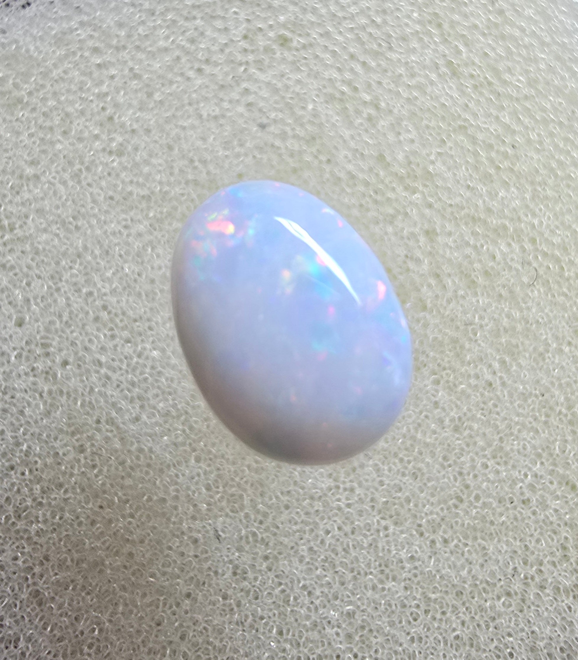 A889 - Pearl white round cut opal