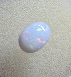 A889 - Pearl white round cut opal