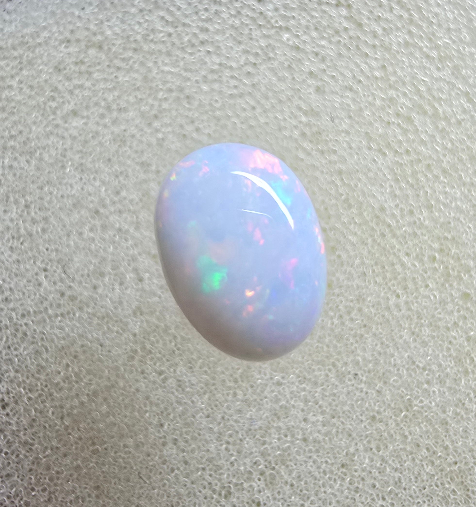 A889 - Pearl white round cut opal