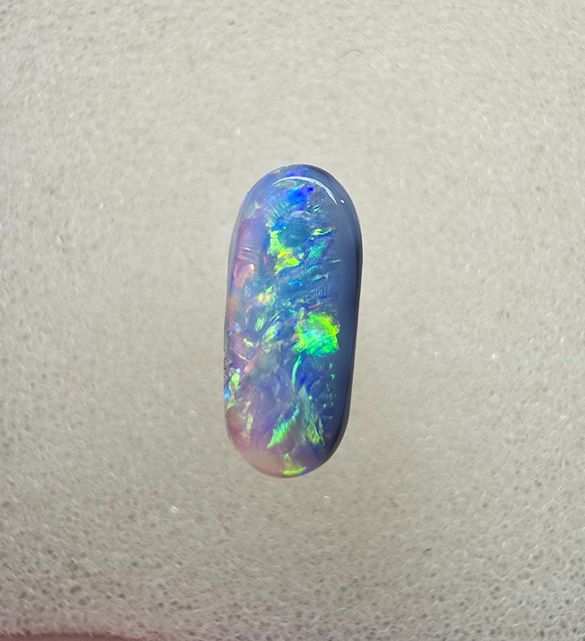 A894 - Oval cut dark crystal opal