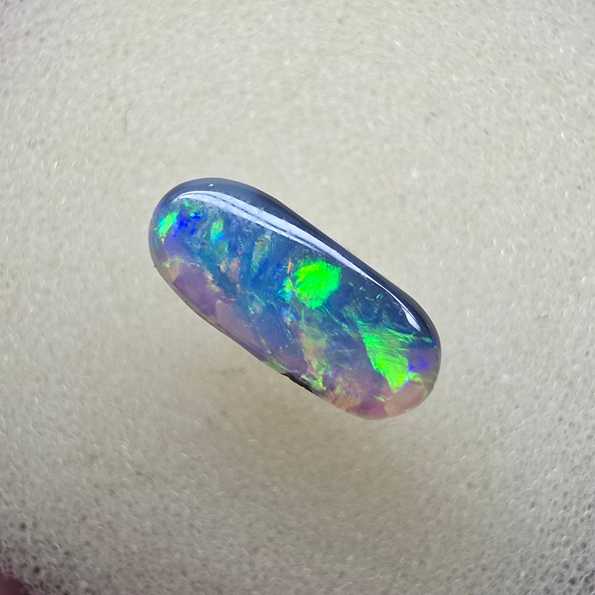 A894 - Oval cut dark crystal opal