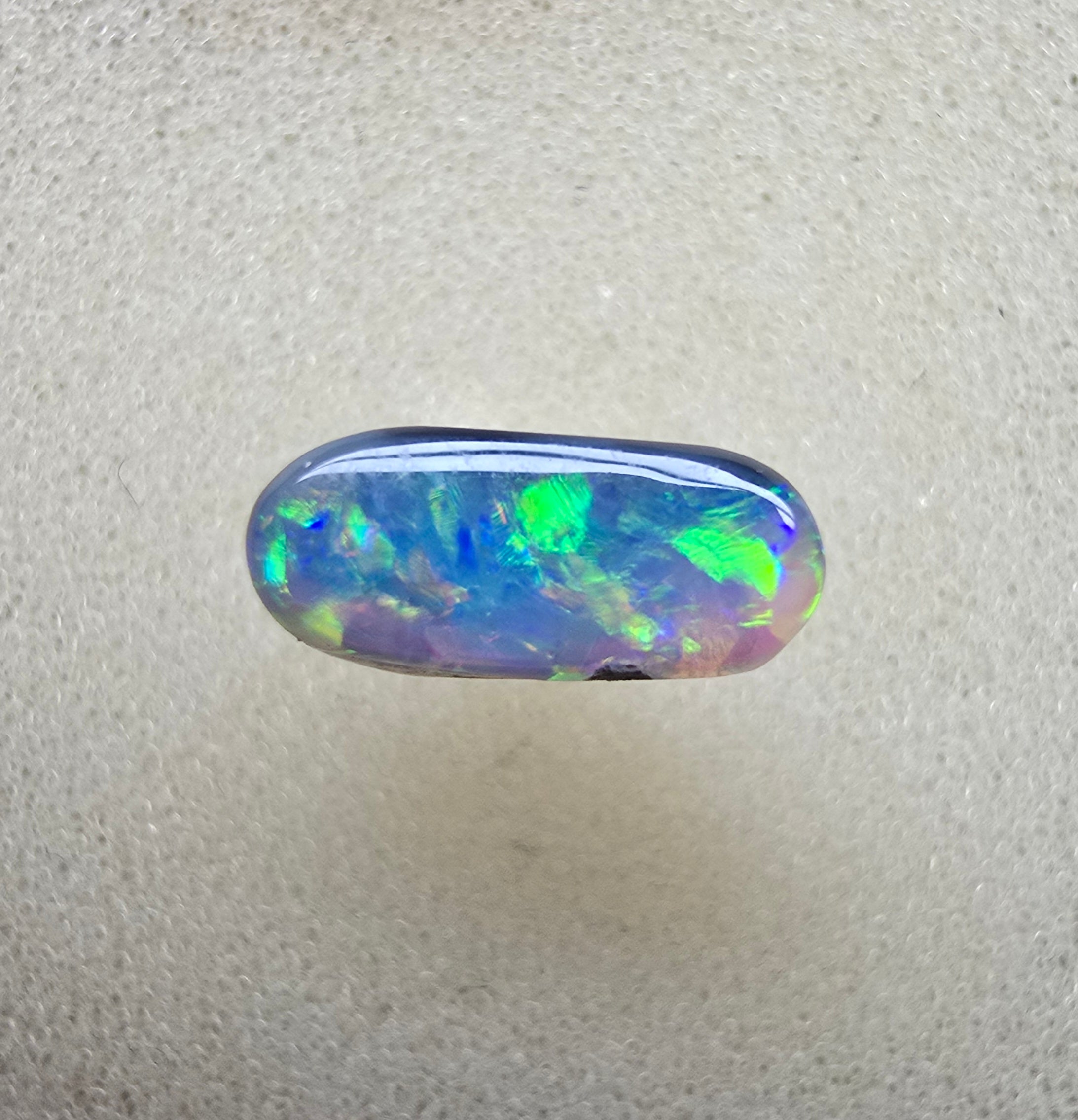 A894 - Oval cut dark crystal opal