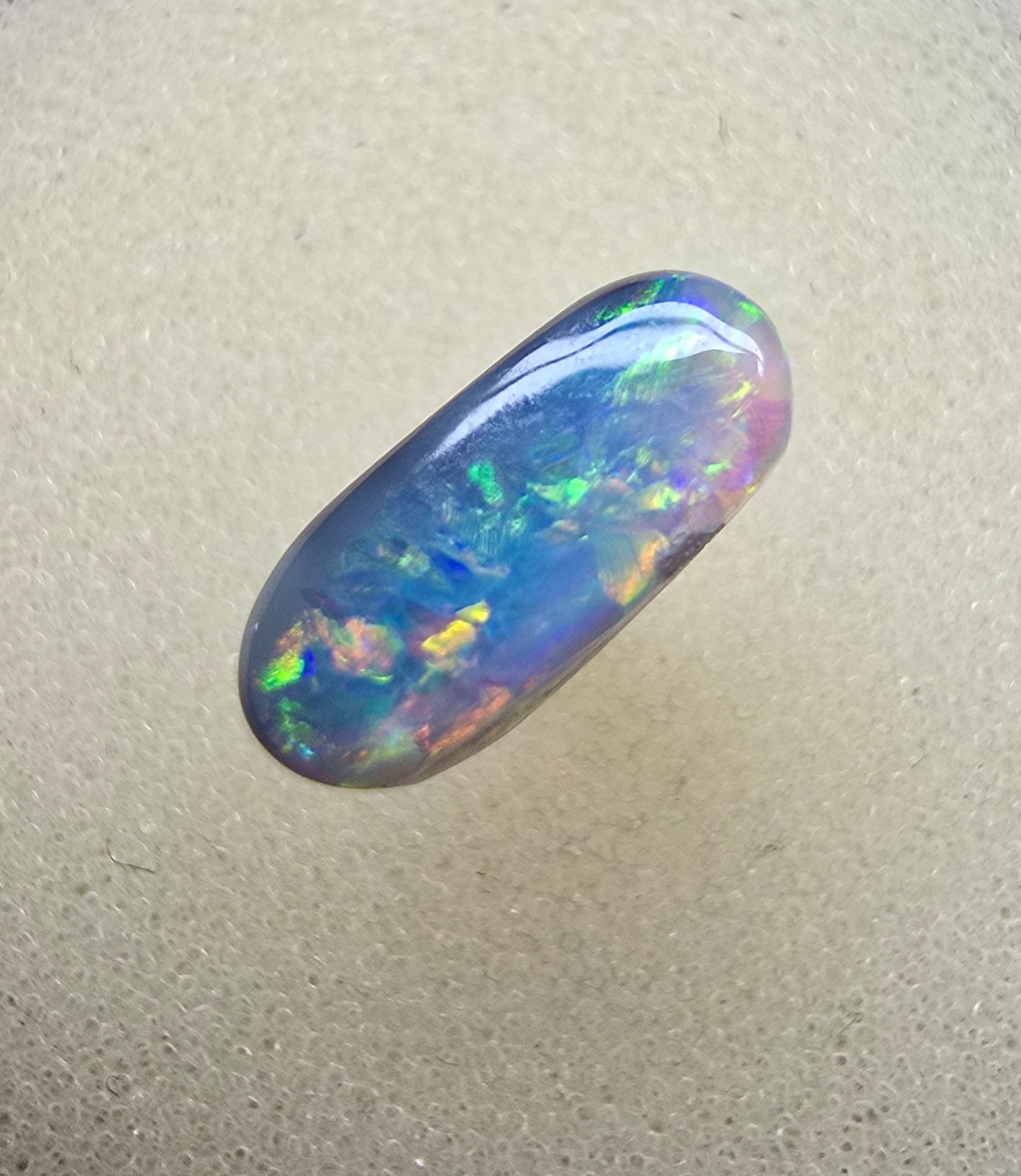 A894 - Oval cut dark crystal opal