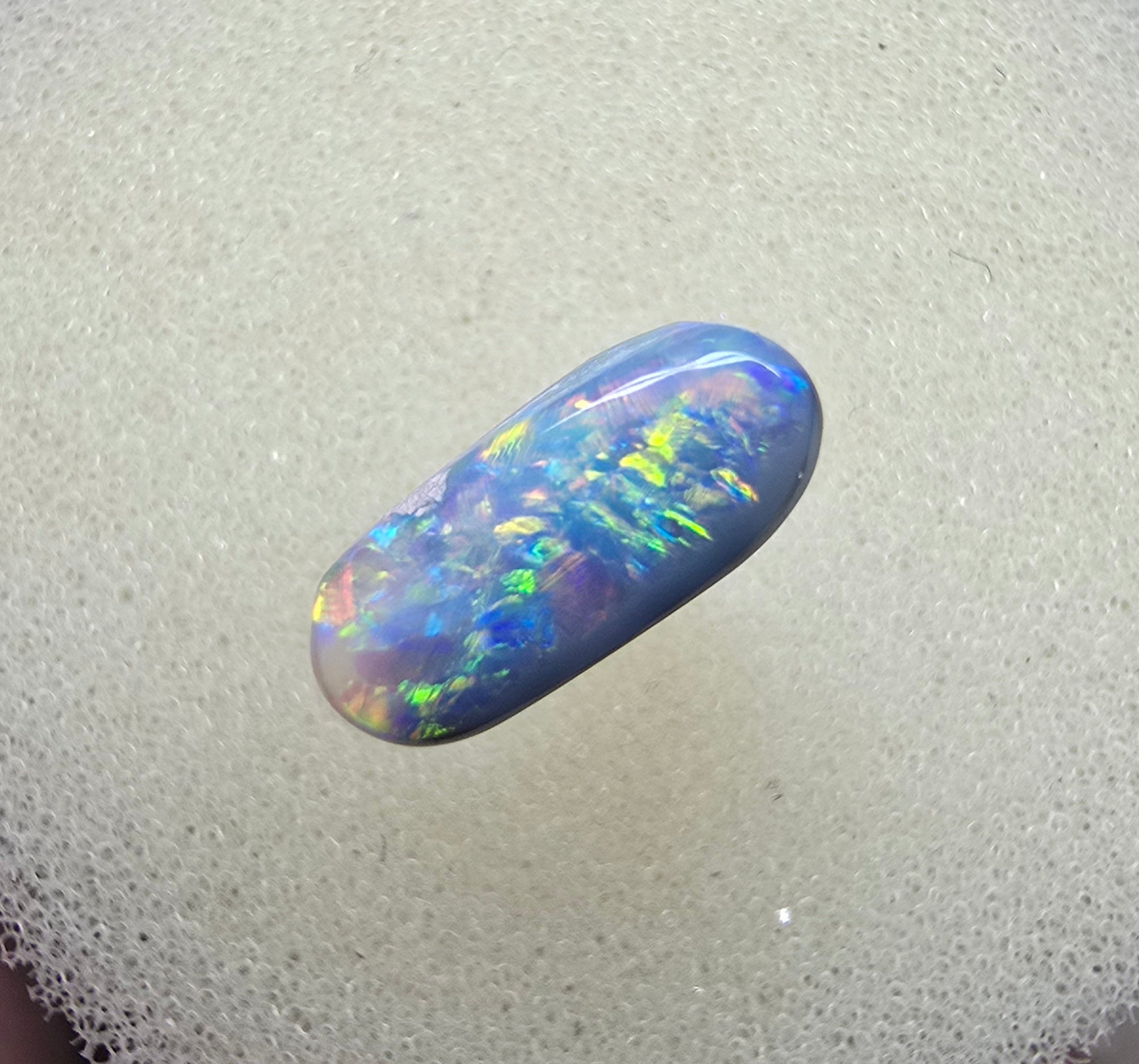 A894 - Oval cut dark crystal opal