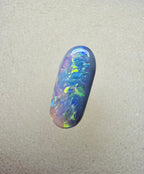A894 - Oval cut dark crystal opal