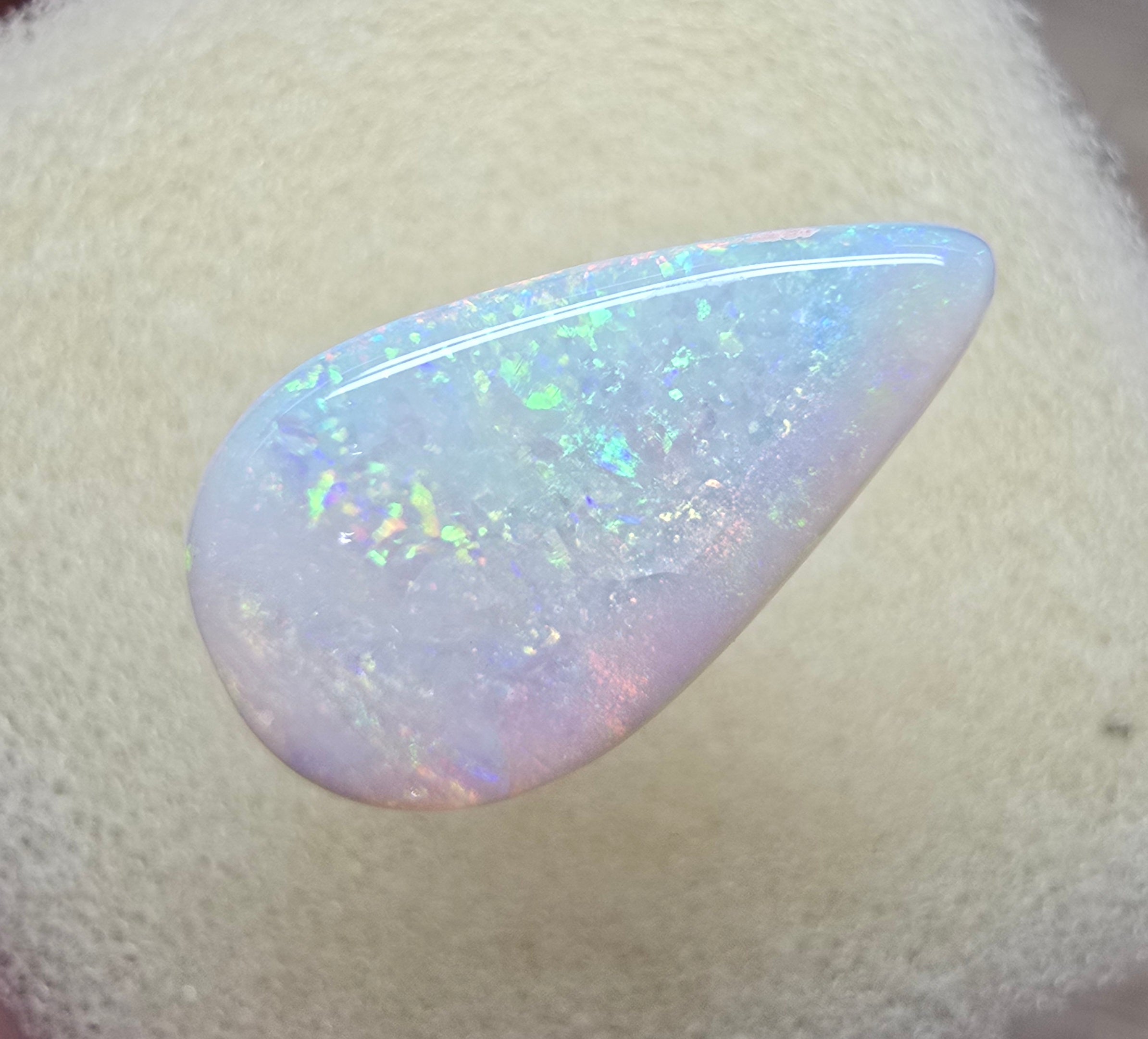 A910 - Bold drop cut white opal.