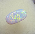 A911 - Oval cut bright red fire white opal