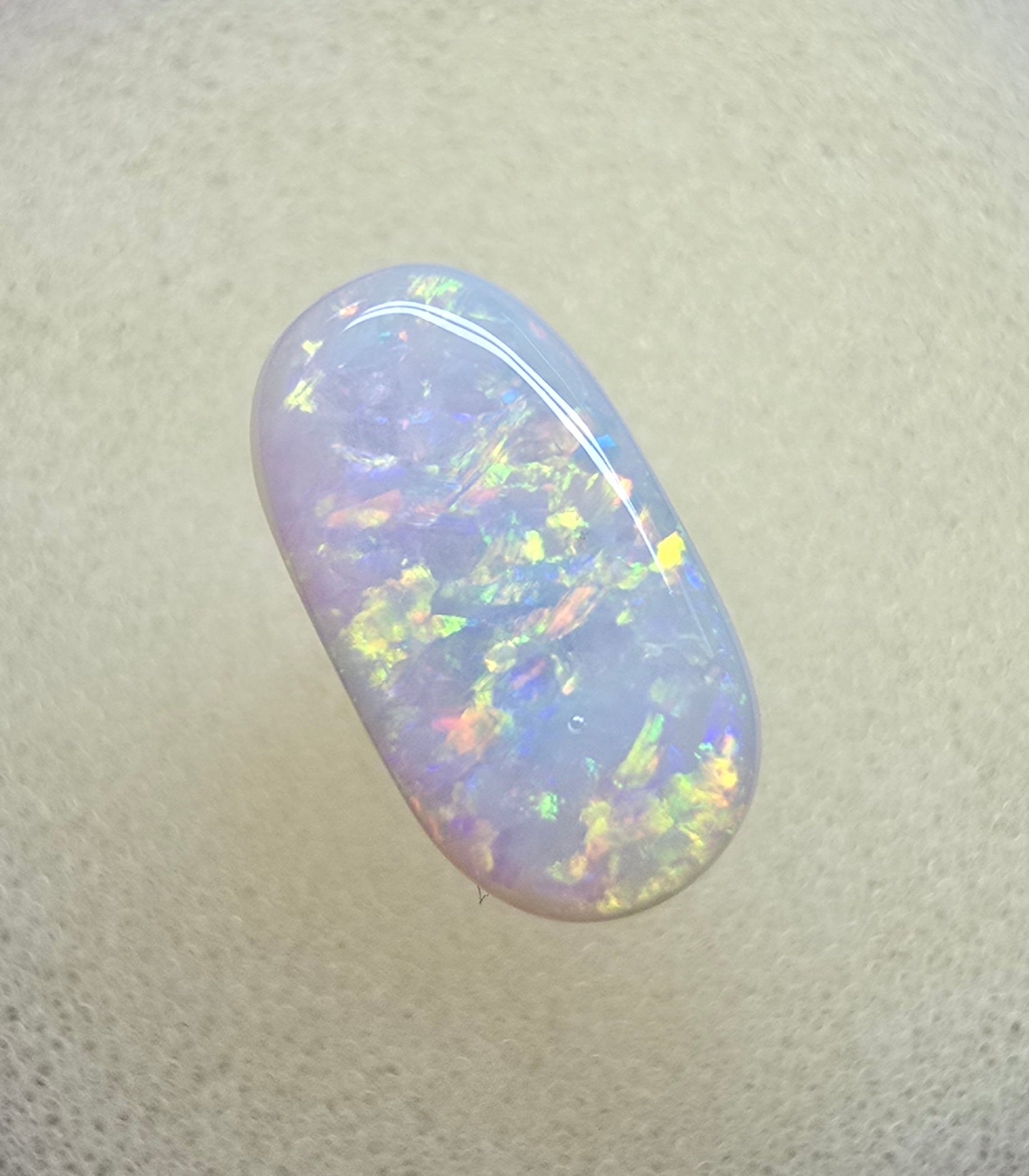 A911 - Oval cut bright red fire white opal