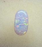 A911 - Oval cut bright red fire white opal